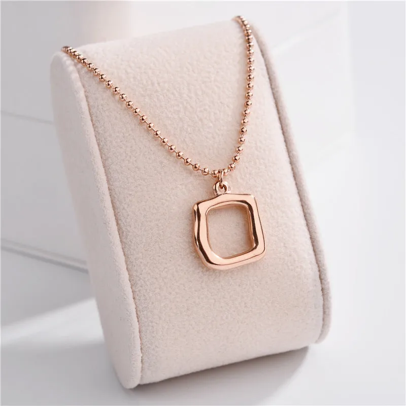 Gold plated titanium necklace with Clavicle Chain and geometric hollow square